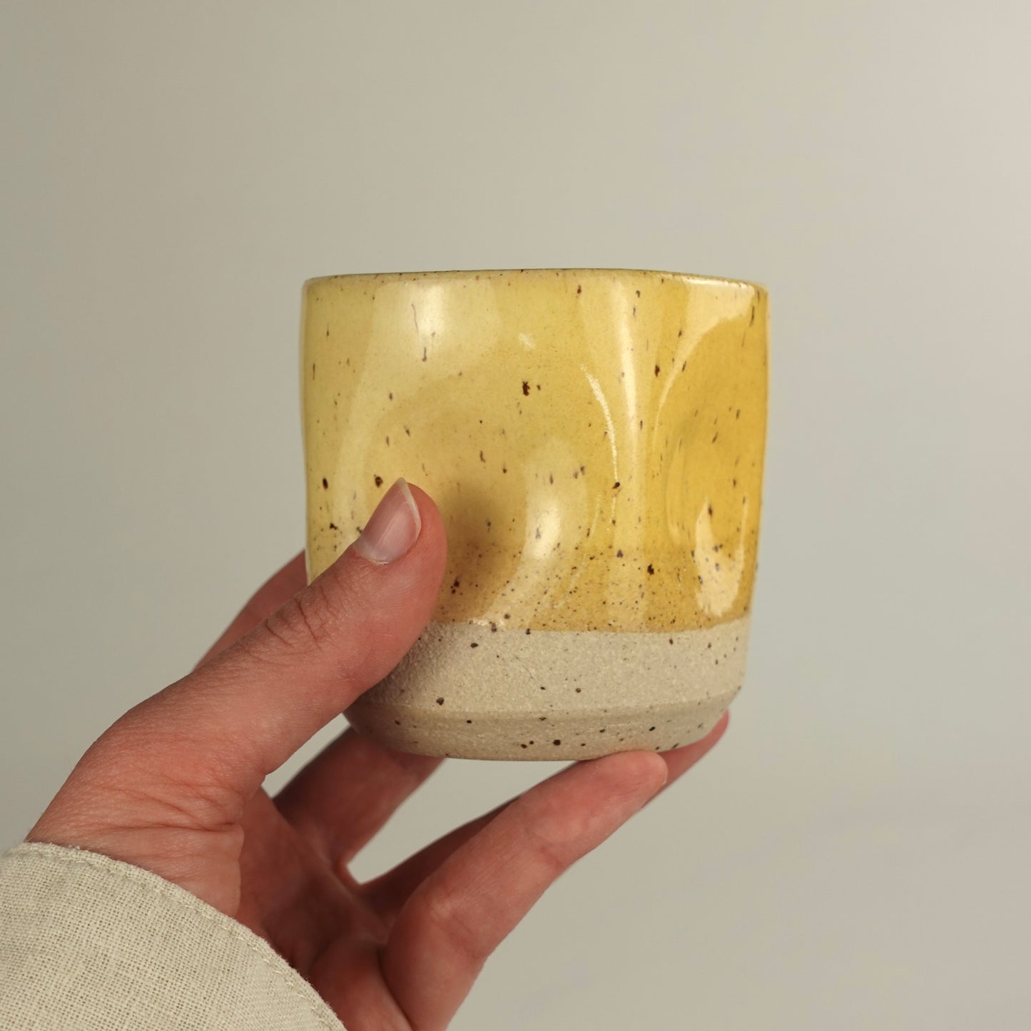 RIVAGE, yellow handleless cup